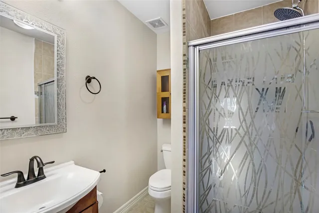 a view of an empty room and wooden floor