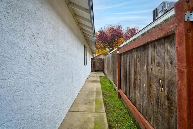 a pathway of a house with backyard