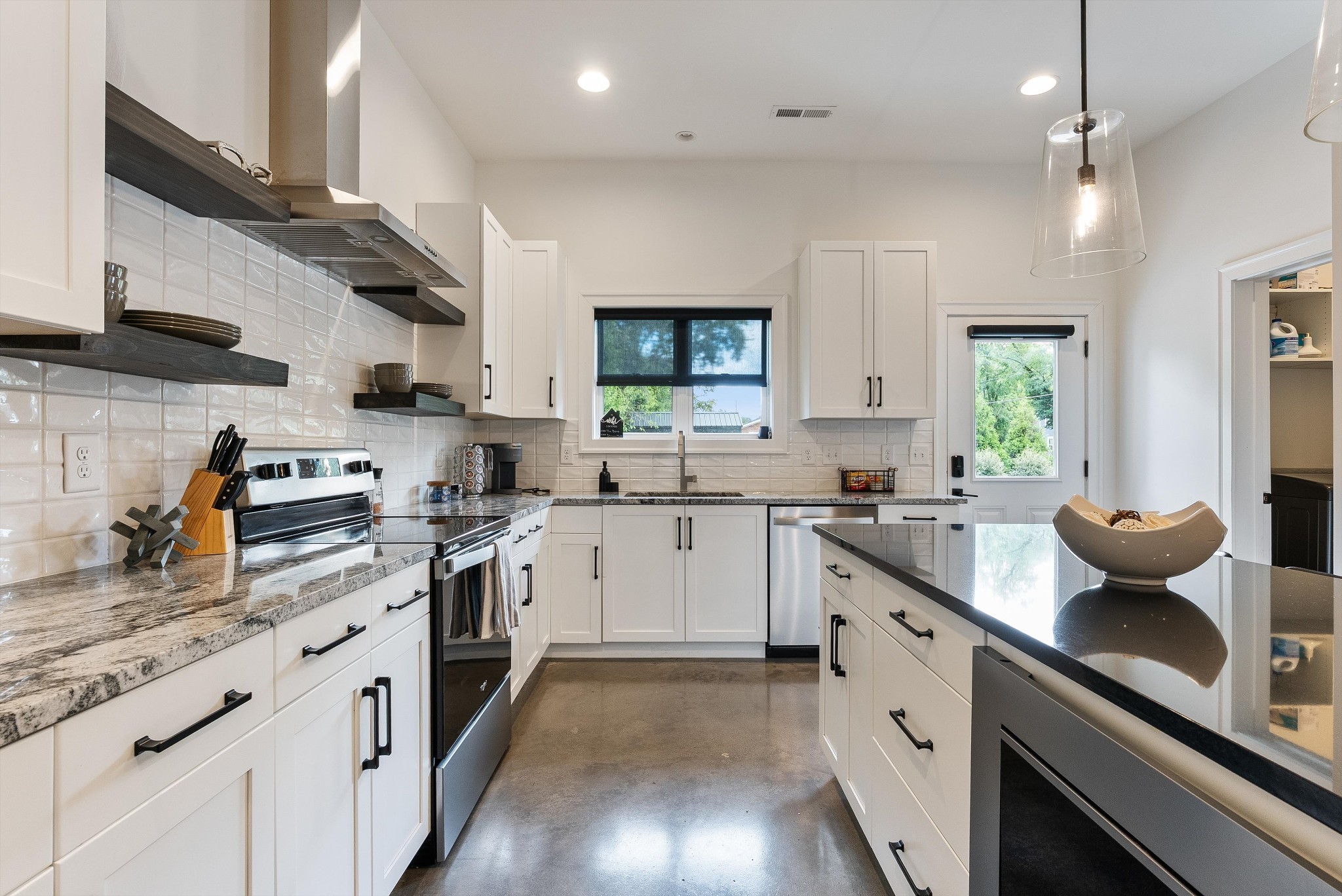 906 North Maple Street Murfreesboro, TN 37130 - Photo 21 of 39 a kitchen with stainless steel appliances white cabinets a sink dishwasher a stove and a refrigerator