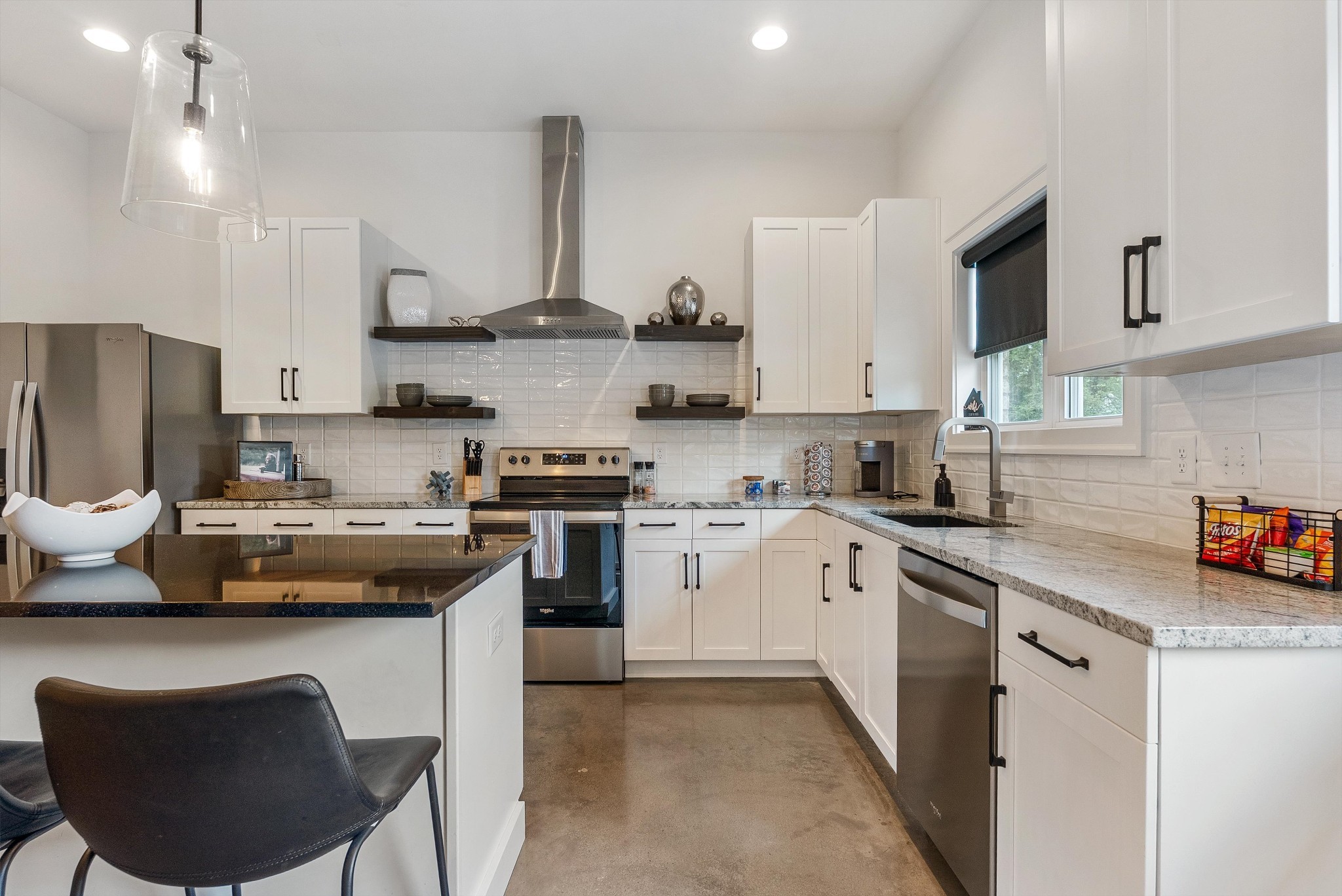906 North Maple Street Murfreesboro, TN 37130 - Photo 22 of 39 a kitchen with stainless steel appliances granite countertop a sink a stove a refrigerator cabinets and chairs