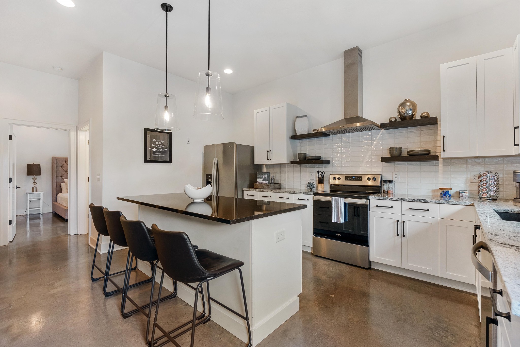 906 North Maple Street Murfreesboro, TN 37130 - Photo 3 of 39 a kitchen with stainless steel appliances kitchen island a table chairs in it and white cabinets
