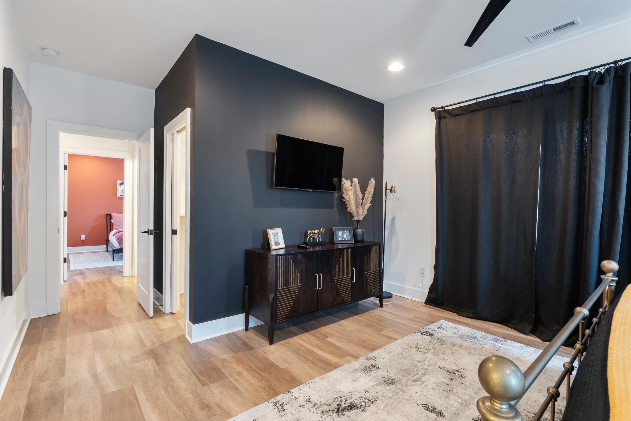 906 North Maple Street Murfreesboro, TN 37130 - Photo 34 of 39 a bedroom with a bed and a flat screen tv