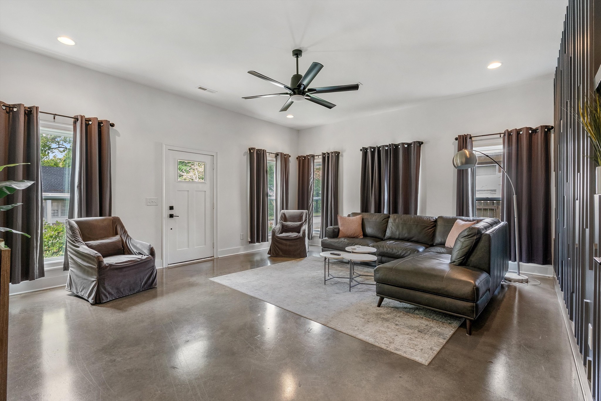 906 North Maple Street Murfreesboro, TN 37130 - Photo 8 of 39 a living room with furniture ceiling fan and a window