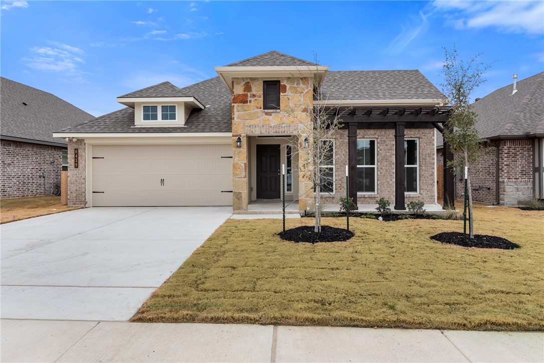 a front view of a house with yard