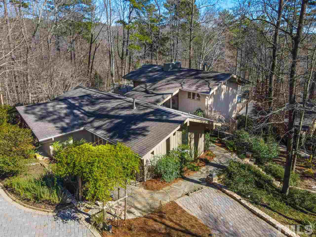 806 Kenmore Road Chapel Hill, NC 27514 - Photo 1 of 30 a view of a backyard with plants