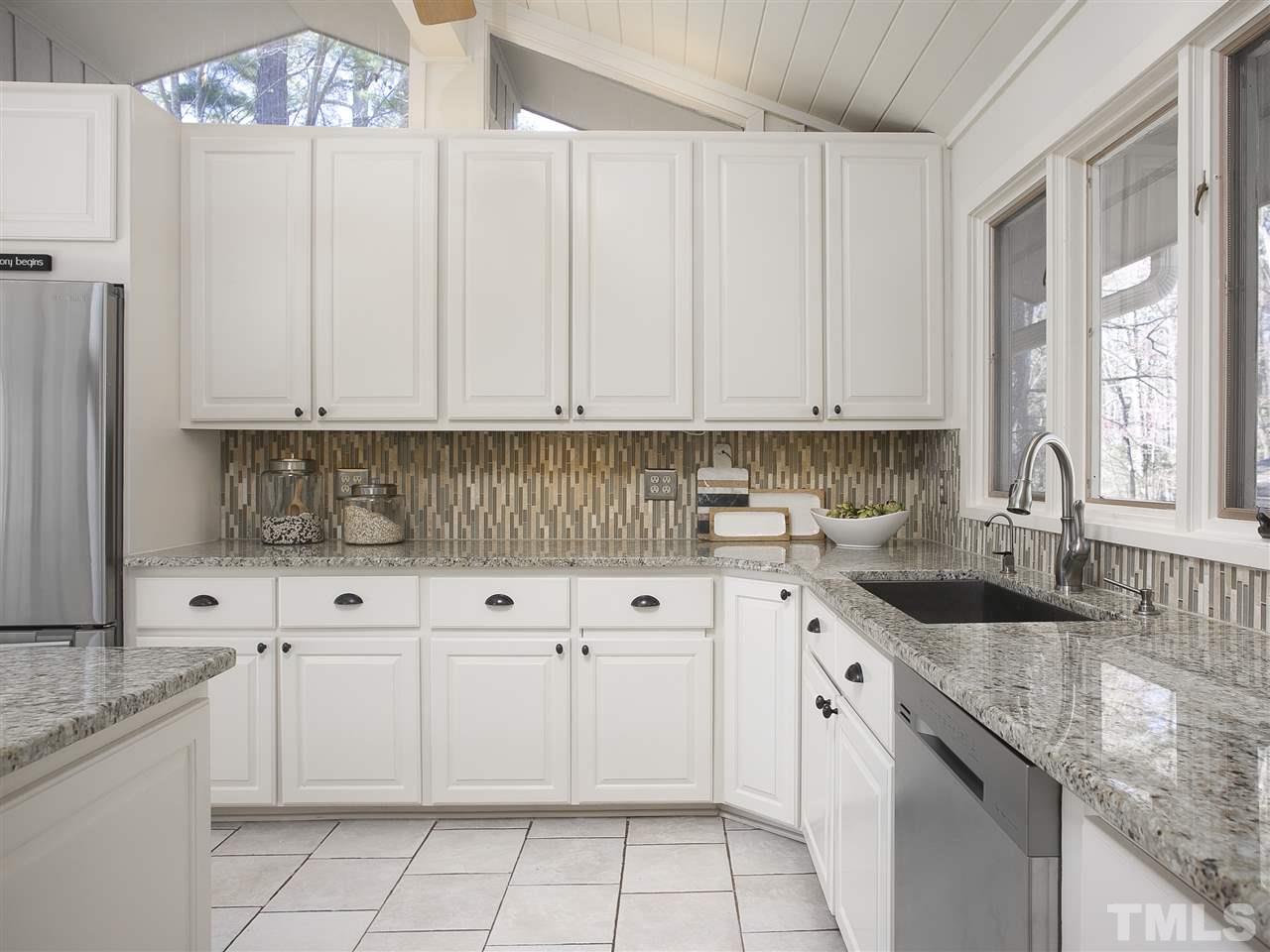 806 Kenmore Road Chapel Hill, NC 27514 - Photo 11 of 30 a kitchen with granite countertop white cabinets white stainless steel appliances and a sink