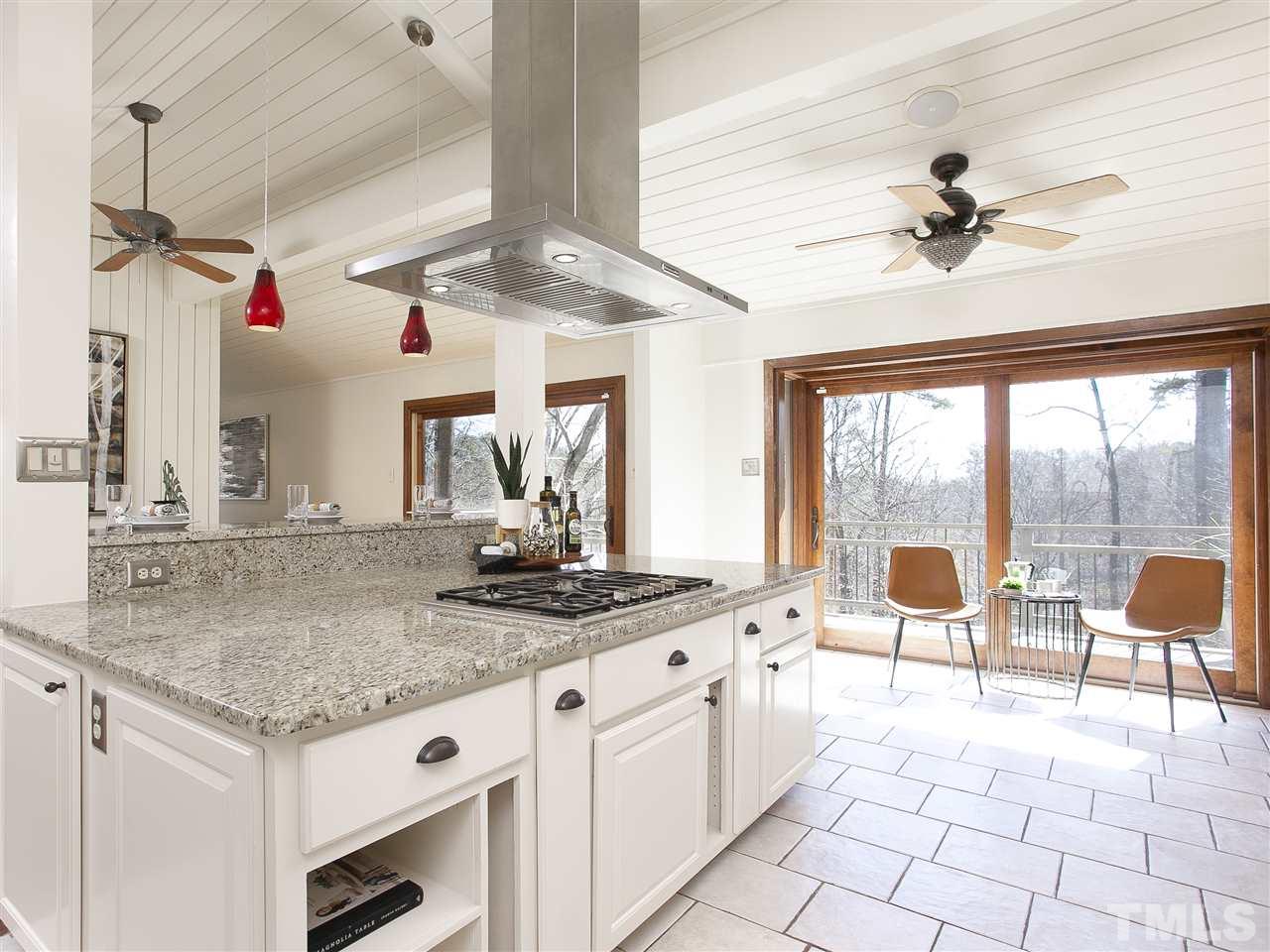 806 Kenmore Road Chapel Hill, NC 27514 - Photo 12 of 30 a kitchen with stainless steel appliances granite countertop a stove a sink and a granite counter tops