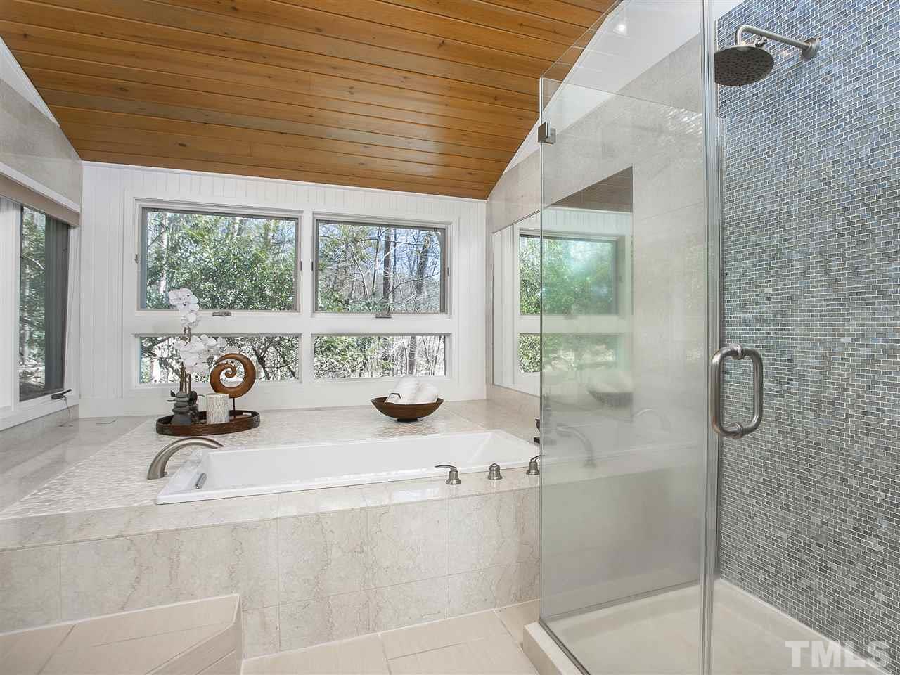 806 Kenmore Road Chapel Hill, NC 27514 - Photo 17 of 30 a view of a bathroom with a tub and window