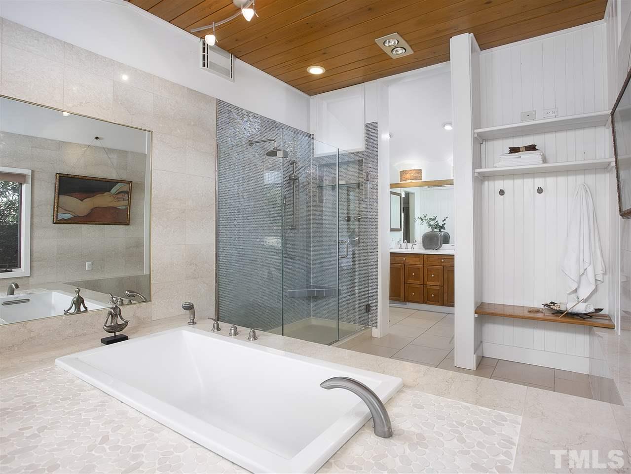 806 Kenmore Road Chapel Hill, NC 27514 - Photo 18 of 30 a spacious bathroom with a tub sink shower and mirror