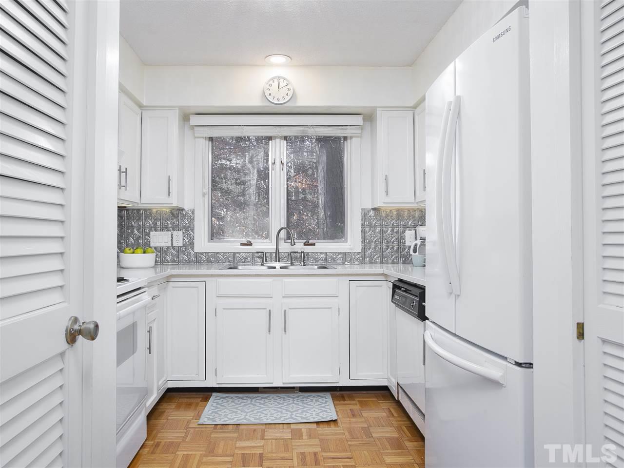 806 Kenmore Road Chapel Hill, NC 27514 - Photo 26 of 30 a large white kitchen with a large window