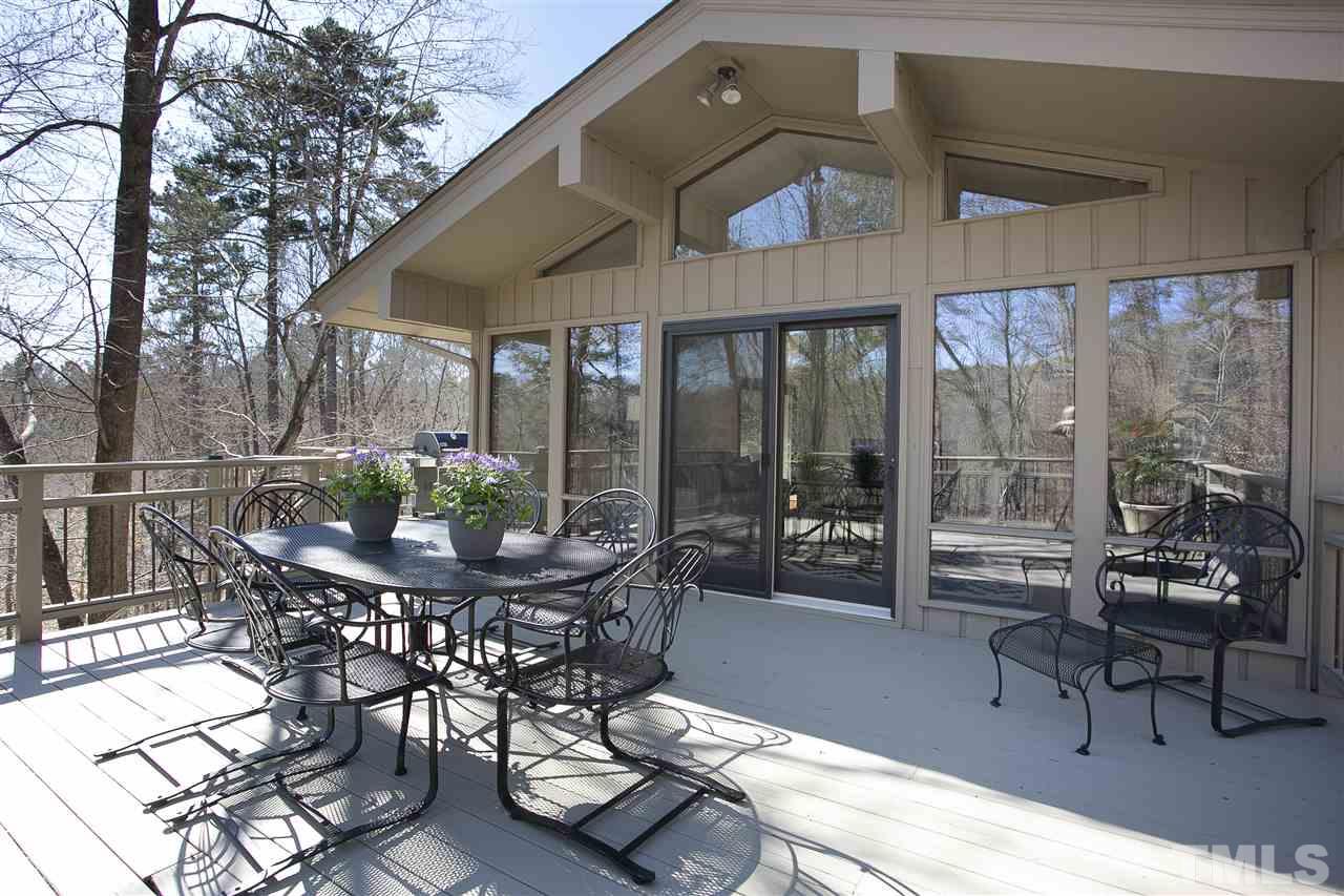806 Kenmore Road Chapel Hill, NC 27514 - Photo 7 of 30 a view of a patio with table and chairs and potted plants
