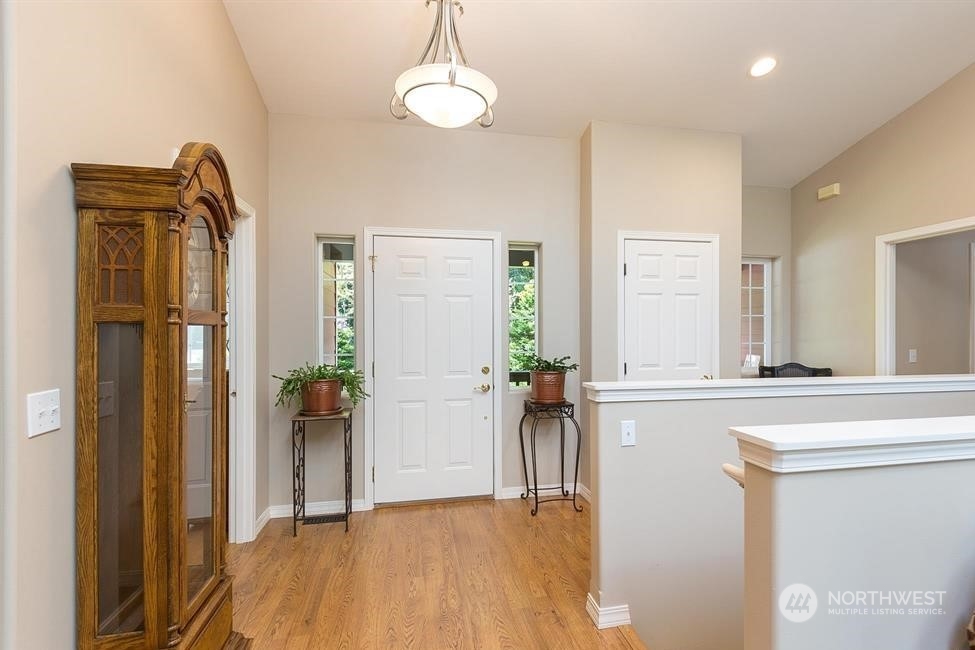50 Henkes Road Sequim, WA 98382 - Photo 12 of 40 a view of a hallway with wooden floor and a living room