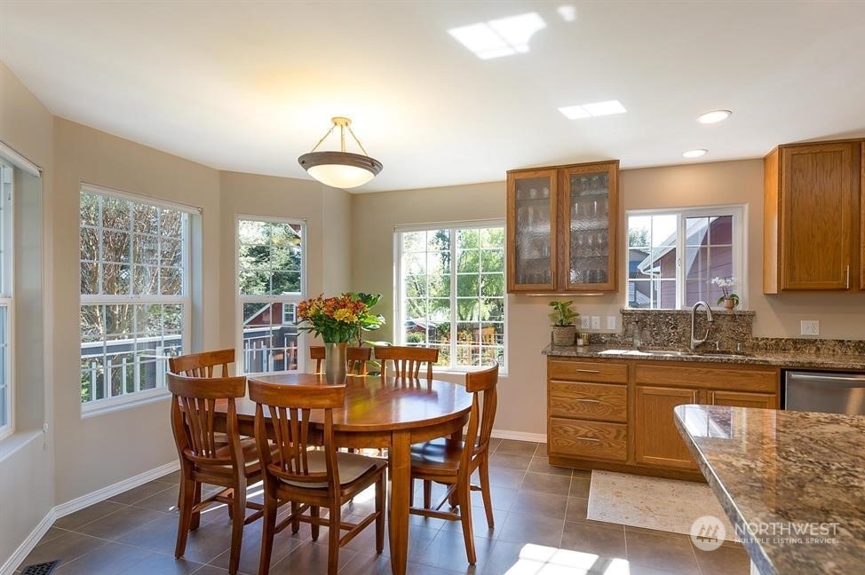 50 Henkes Road Sequim, WA 98382 - Photo 17 of 40 a dining room with furniture a chandelier and wooden floor