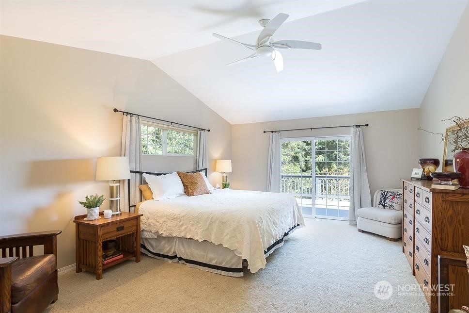 50 Henkes Road Sequim, WA 98382 - Photo 18 of 40 a bedroom with a bed and a table