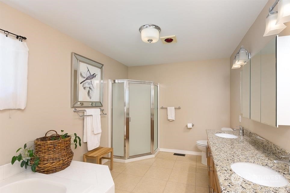 50 Henkes Road Sequim, WA 98382 - Photo 21 of 40 a bathroom with a granite countertop sink and a mirror
