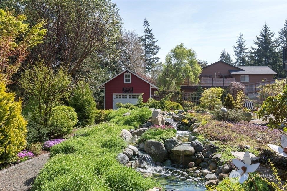 50 Henkes Road Sequim, WA 98382 - Photo 5 of 40 a view of a house with a yard and plant