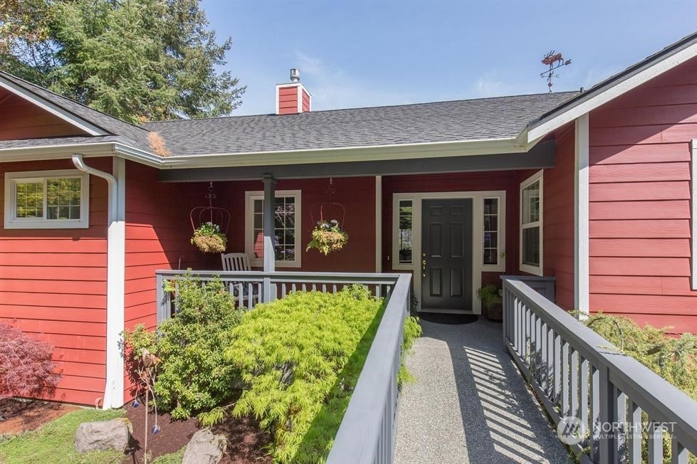 50 Henkes Road Sequim, WA 98382 - Photo 9 of 40 a view of a house with a balcony