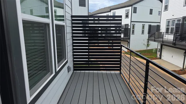 a view of balcony and wooden floor