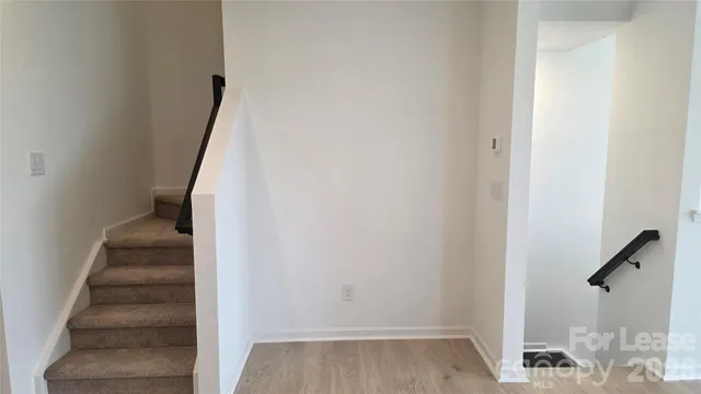 a view of entryway with wooden floor
