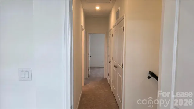 a view of a bathroom from a hallway