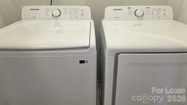 a utility room with dryer and washer
