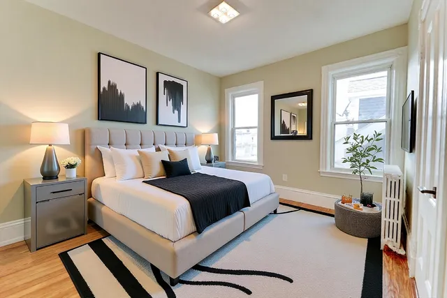 a bedroom with a bed and a couch