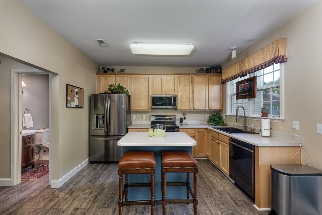 424 Willingham Road Morrisville, NC 27560 - Photo 8 of 30 Updated Black stainless steel appliances. Island gives extra counter space and extra casual seating Kitchen