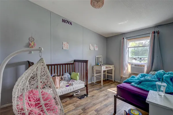 a bed room with furniture and a window