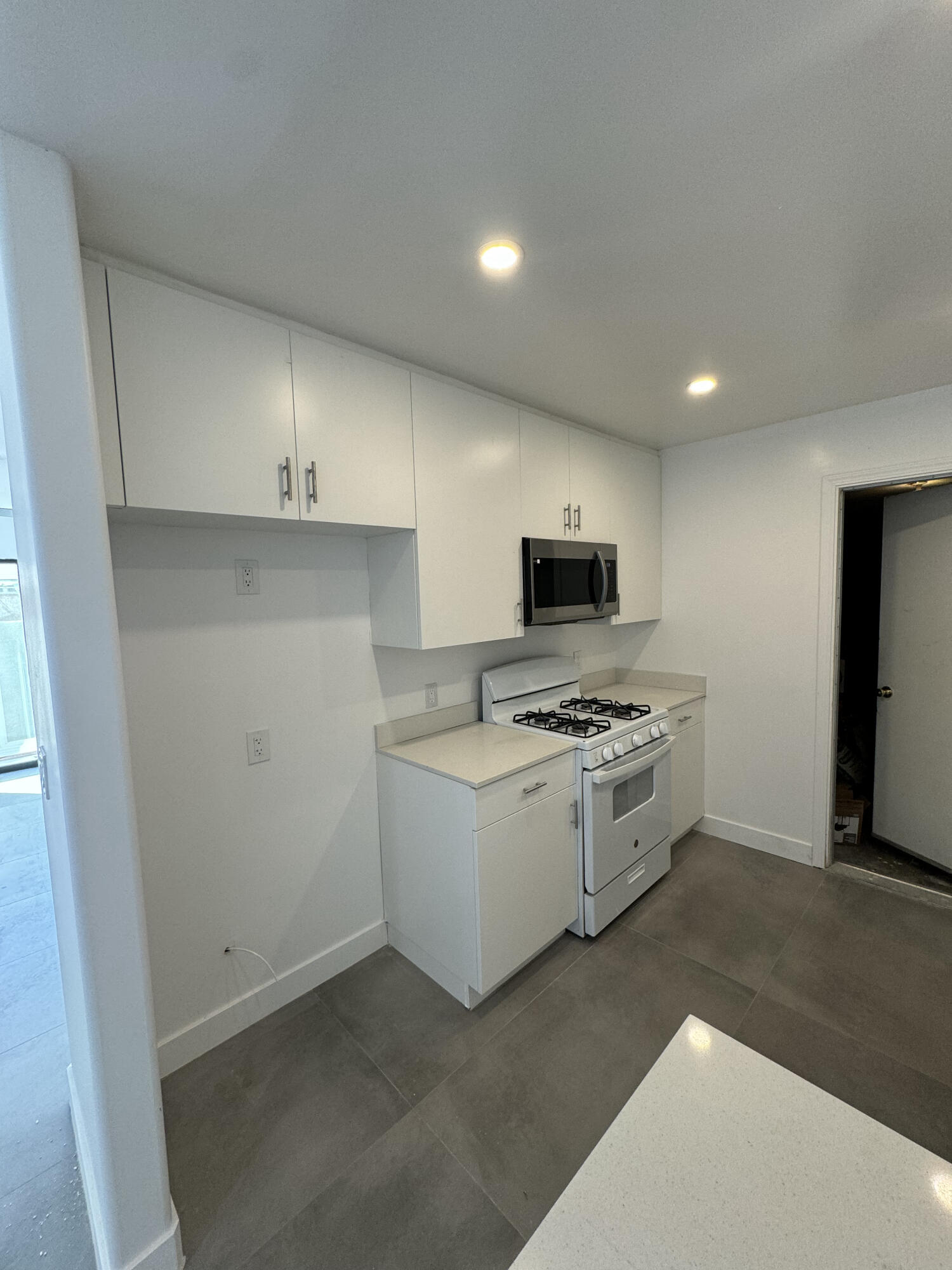 32525 Monte Vista Road Cathedral City, CA 92234 - Photo 2 of 10 a kitchen with stainless steel appliances granite countertop a stove a sink and a refrigerator