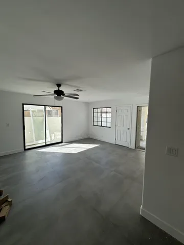 a view of empty room with windows
