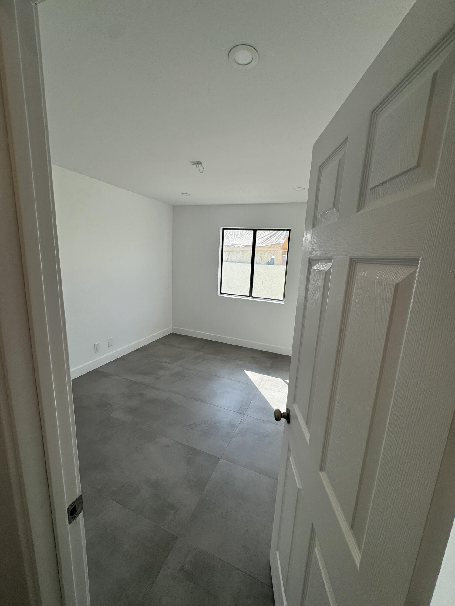 32525 Monte Vista Road Cathedral City, CA 92234 - Photo 4 of 10 an empty room with windows