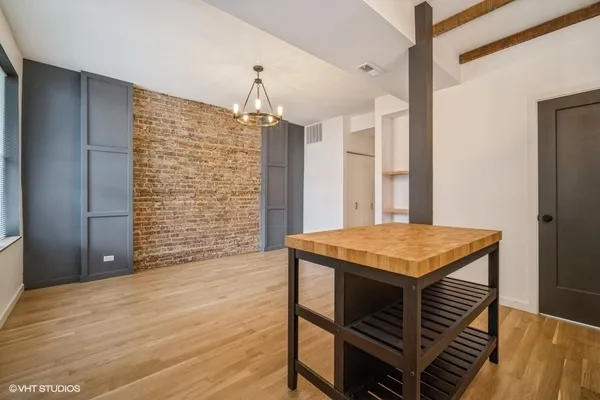 a bathroom with a sink a toilet and bathtub