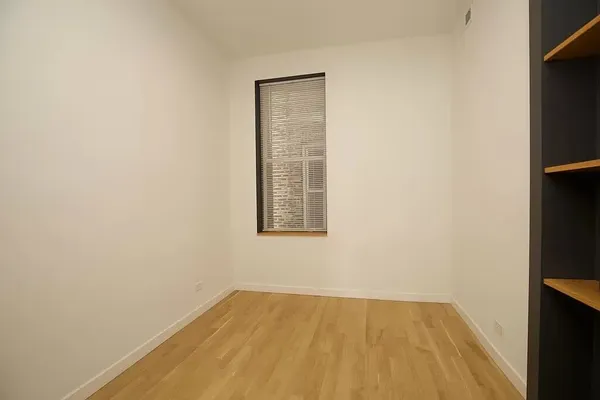 a kitchen with granite countertop a stove and a refrigerator