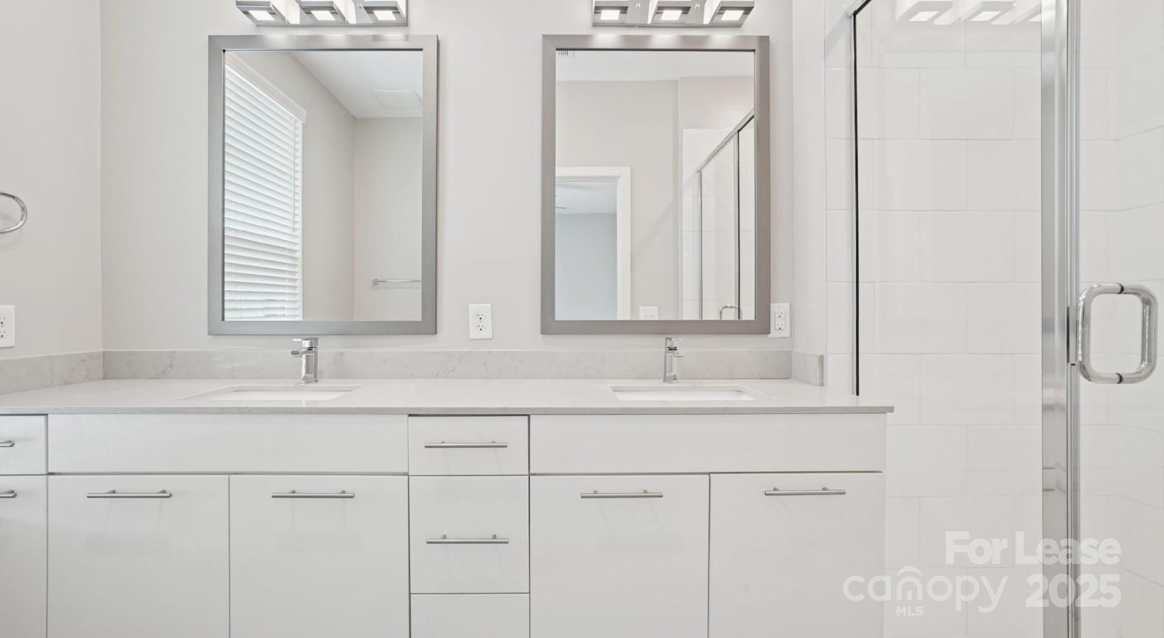 4010 Waiting Street, Unit C3 Matthews, NC 28105 - Photo 13 of 36 a bathroom with a sink and a mirror