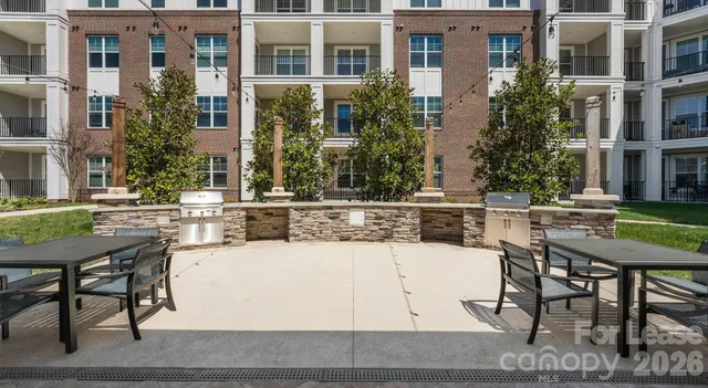 a view of a building with sitting area
