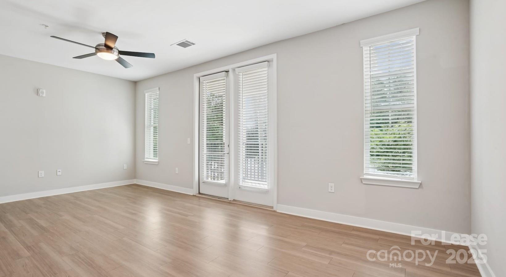 4010 Waiting Street, Unit C3 Matthews, NC 28105 - Photo 4 of 36 a view of an empty room with a window