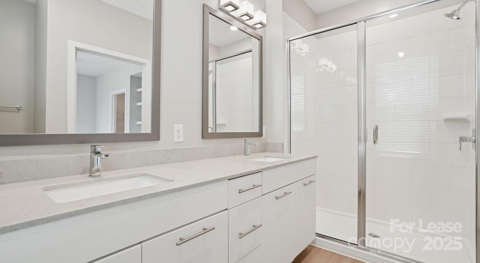 4010 Waiting Street, Unit C3 Matthews, NC 28105 - Photo 9 of 36 a bathroom with a sink and a mirror
