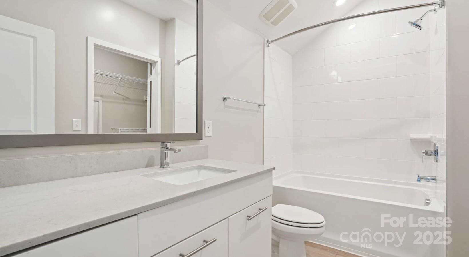 4010 Waiting Street, Unit C3 Matthews, NC 28105 - Photo 10 of 36 a bathroom with a sink a toilet and a bathtub
