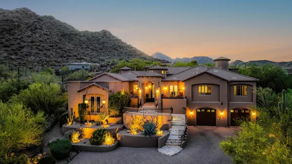 an aerial view of a house with garden and patio