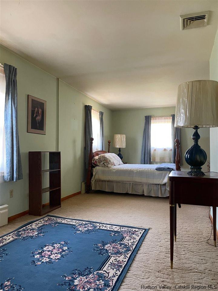 307 Blue Mountain Road Saugerties, NY 12477 - Photo 11 of 20 a bedroom with a bed and a couch