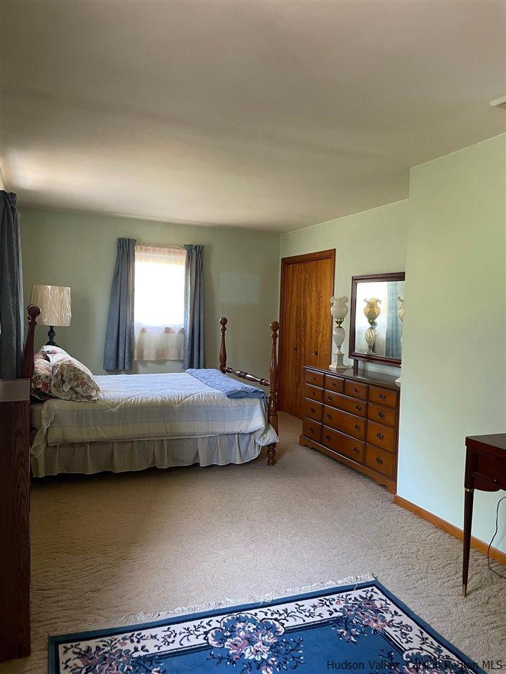 307 Blue Mountain Road Saugerties, NY 12477 - Photo 12 of 20 a bedroom with a bed and furniture
