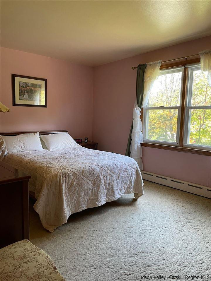 307 Blue Mountain Road Saugerties, NY 12477 - Photo 13 of 20 a bedroom with a bed and a window