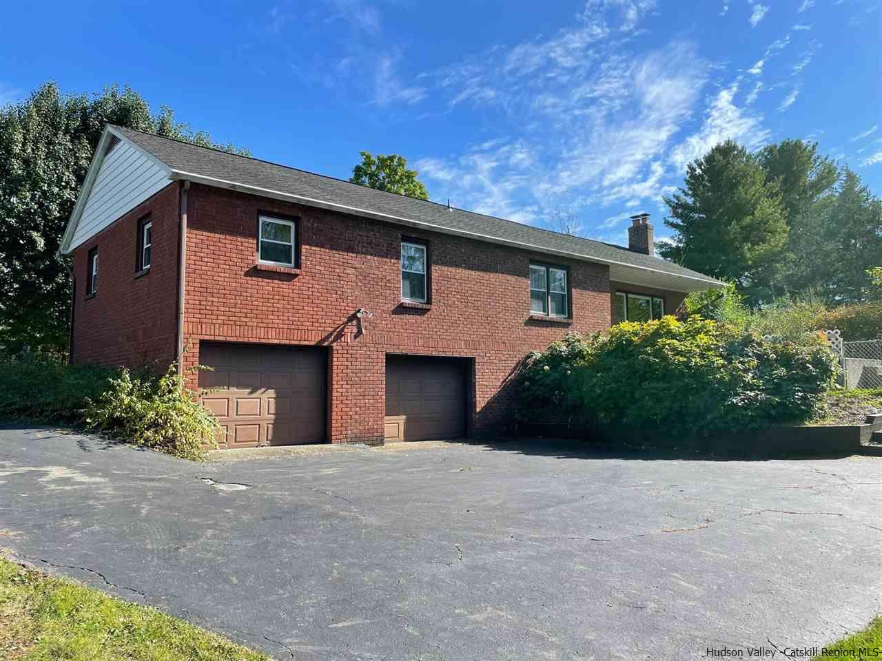 307 Blue Mountain Road Saugerties, NY 12477 - Photo 20 of 20 a front view of a house with a garden