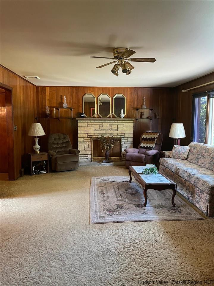 307 Blue Mountain Road Saugerties, NY 12477 - Photo 9 of 20 a living room with furniture and a fireplace