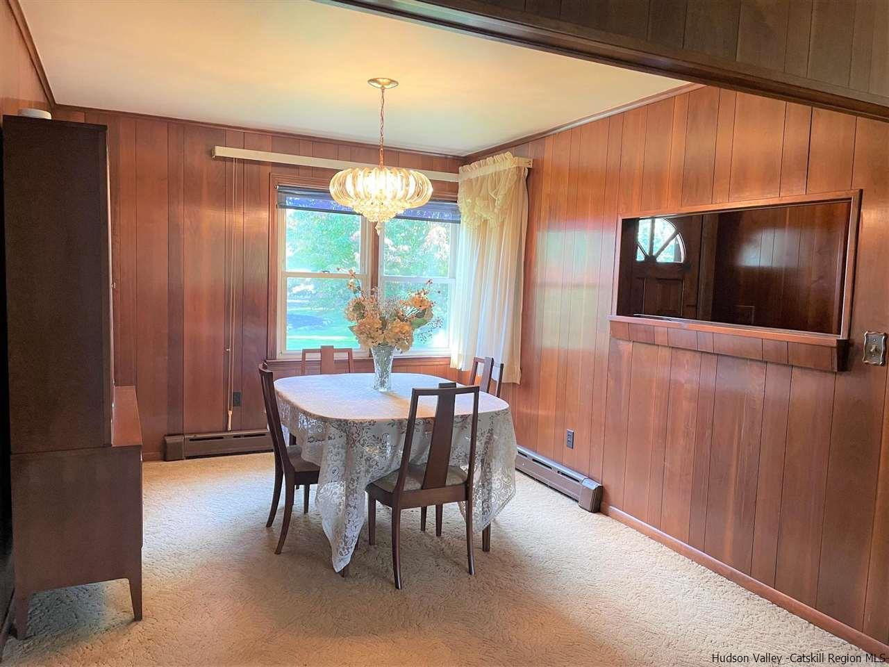 307 Blue Mountain Road Saugerties, NY 12477 - Photo 10 of 20 a view of a dining room with furniture window and outside view