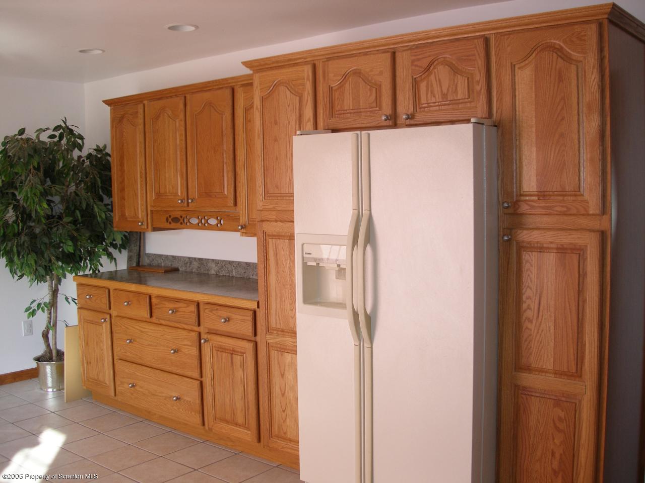 2127 Rr, Unit 2 Nicholson, PA 18446 - Photo 3 of 9 a kitchen with stainless steel appliances granite countertop a refrigerator and a cabinets with wooden floors