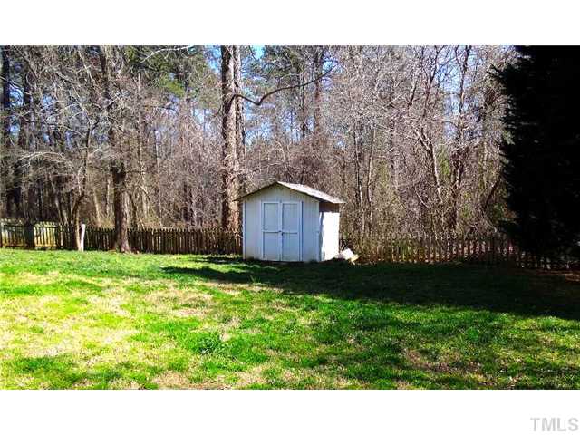 4305 Fathom Court Raleigh, NC 27606 - Photo 11 of 16 Utility shed with heavy woods behind. Yours to enjoy without property taxes.