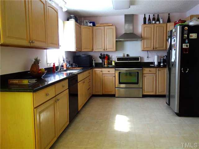 4305 Fathom Court Raleigh, NC 27606 - Photo 4 of 16 Oversized kitchen with granite countertops and upscale appliances