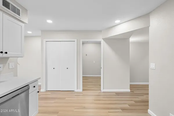 a view of hallway with wooden floor