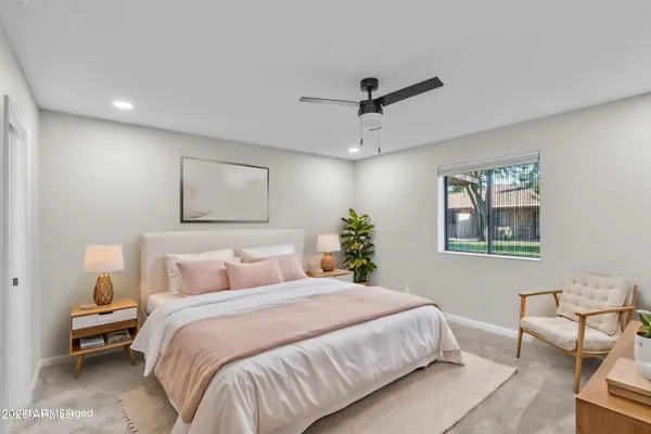 a view of a hallway with a chandelier fan